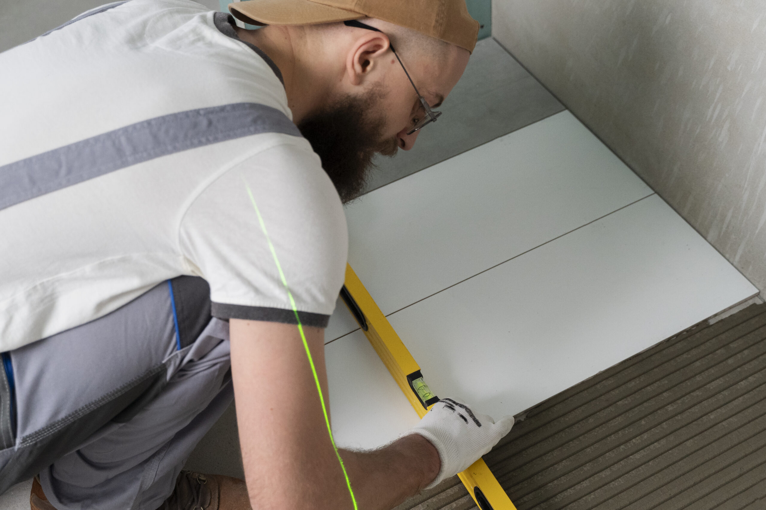 tiler working renovation apartment